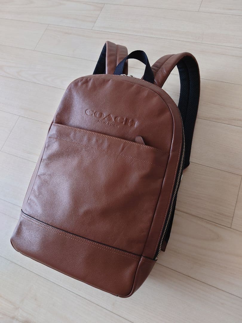 COACH ブラウンレザーリュック - メルカリ