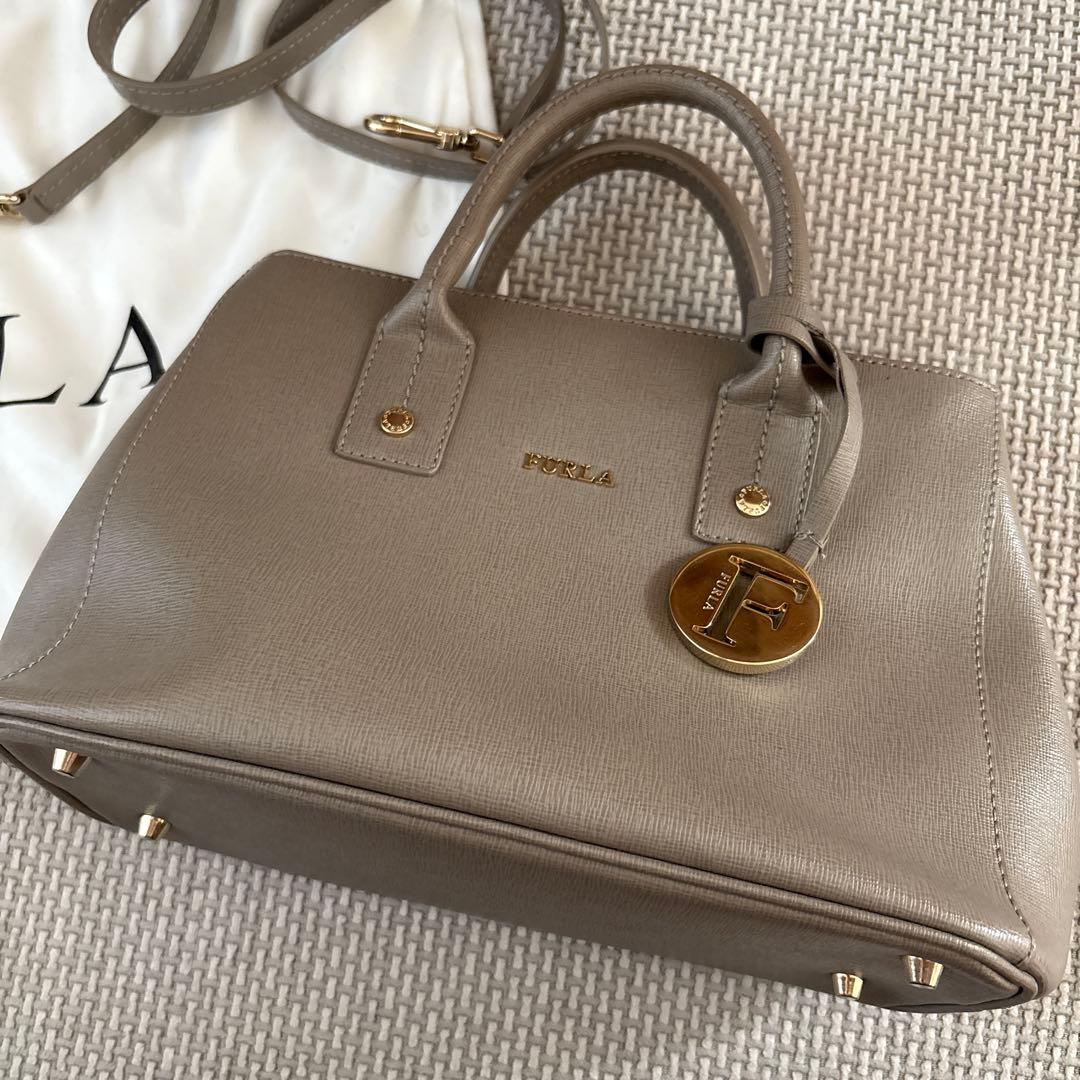 FURLA グレー レザー ハンドバッグ 保存袋付き - メルカリ